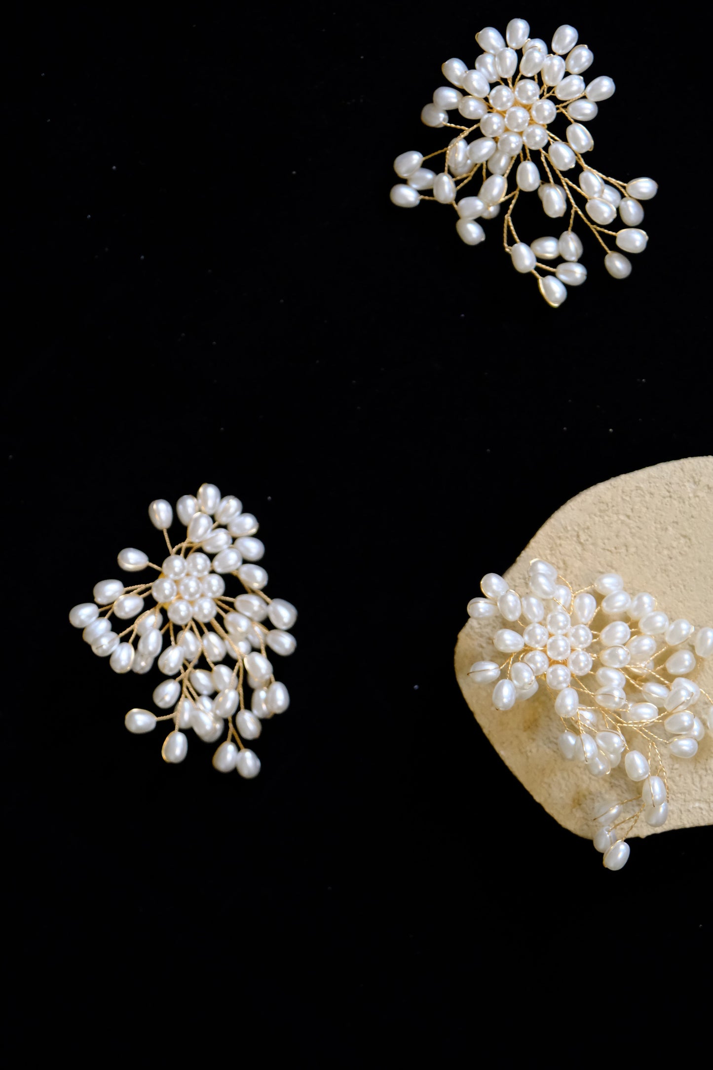 The DUOs Iconic Pearly Falls Cluster Earrings